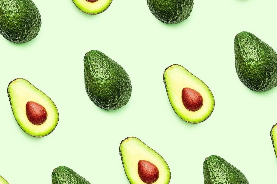 A pattern of whole and halved avocados on a light green background, representing nutrient density and daily intake.